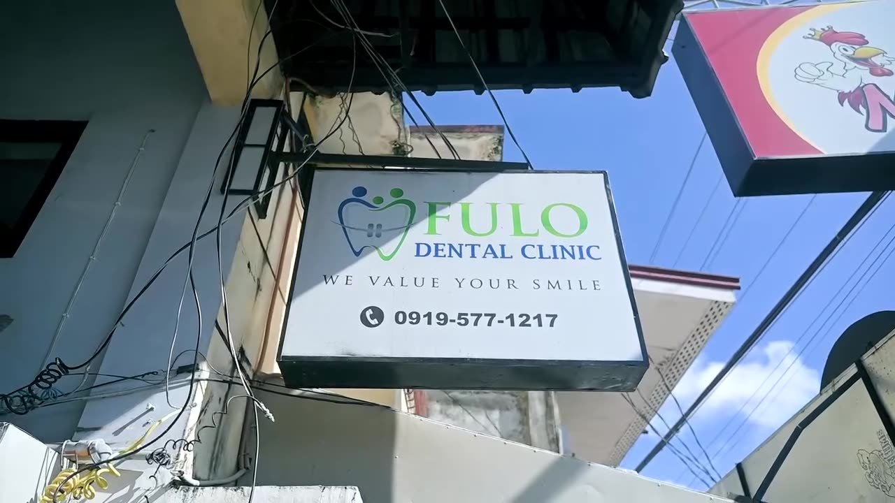 The Fulo Dental Clinic street sign on Manook St., showing the phone number